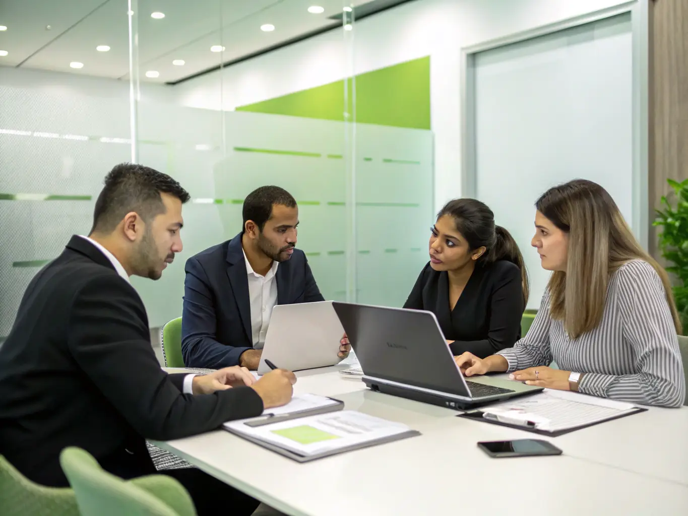 An image depicting a diverse group of Mexican professionals collaborating on financial planning, symbolizing inclusive financial solutions.
